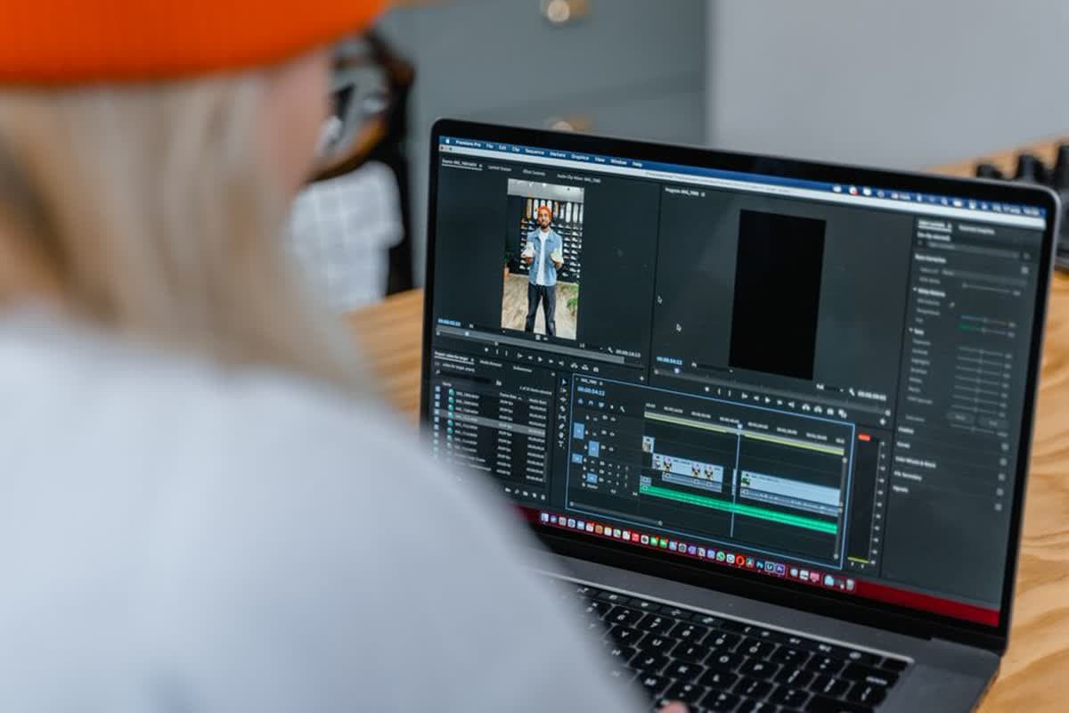Video editing software open on a laptop showing an editing timeline